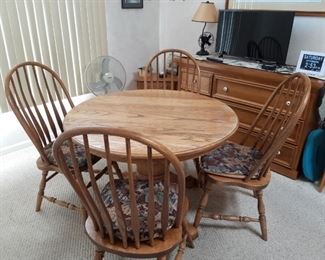 Oak dining room table and chairs and matching sideboard