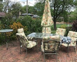 Pretty outdoor set with newer cushions and umbrella