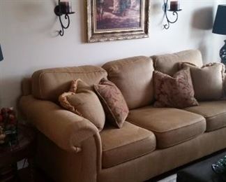 Sherrill Furniture 3-cushion sofa, Roger Williams "Monastery" framed artwork, 2 wall-mount candle sconces, detail of rug