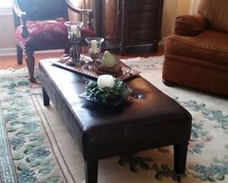Coffee table/bench, detail of rug, metal tray, SLaH candle holders