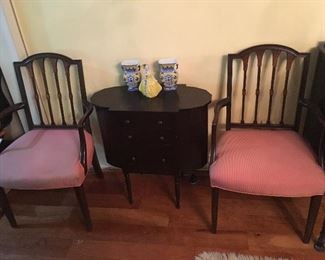 2 Antique Chairs with antique sewing table which has flip up side top pieces for storage.