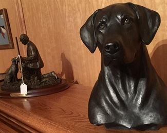 Sculptures, bronzes and more art pieces at this sale including this black lab and hunter.