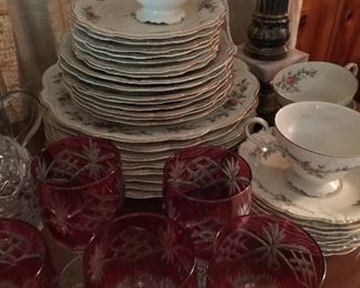 Many sets of china and crystal stemware