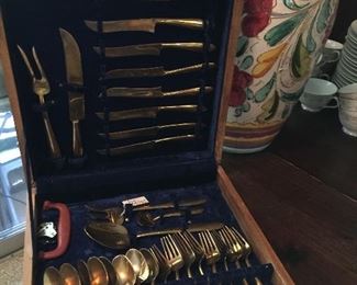 Unique brass flatware set in case.