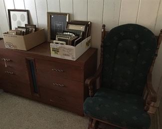 Glider/rocker, great little dresser, lots of picture frames.
