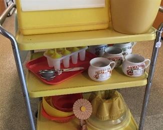 Vintage metal rolling cart in original paint.