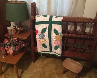 Pair of twin spindle beds, handmade quilt, side table, little wooden lamp