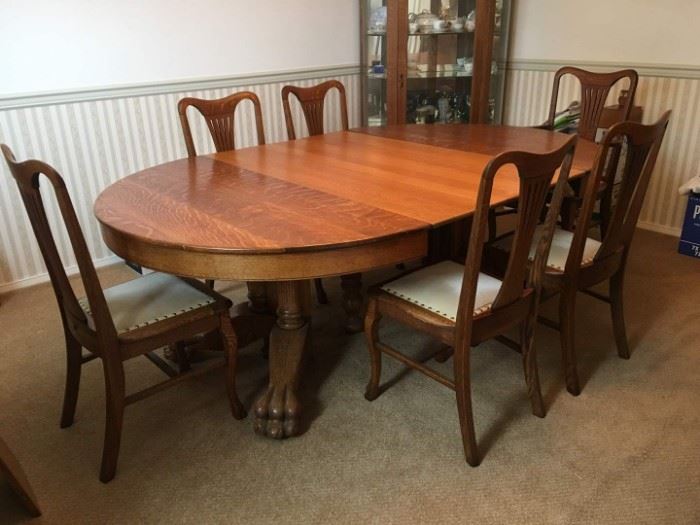 Beautiful Antique Oak Dining Table&nbsp;with Large Carved Claw Feet. Includes 6 Dining Chairs with Hammered Tack Detail. 