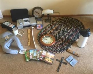 Assortment of Items For Your Home: Braided Rug, Heavy Bankers Lamp, Wall Clocks, VCR, Fantasia VHS, Cassettes, more
Lot Number: 71