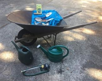 Vintage Wheelbarrow, Gardening Tools, Sprinklers, Watering Cans, Tarp.
Lot Number: 73