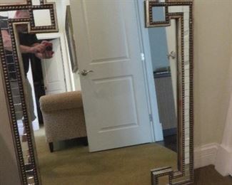 John Richards Omega Mirror. 35''W X 49''H X 2''D A clear center mirror is framed by smaller individual mirrors with beaded molding. It is equipped to hang vertically or horizontally.