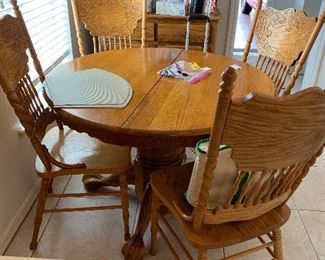There are 7 chairs and a leaf