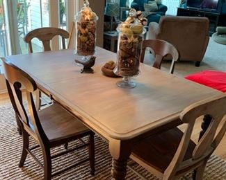 kitchen table with four chairs and rustic gray finish