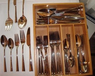 Living Room: A set of quality DANSK "Bistro Café" flatware in a wooden cutlery box includes: 6 dinner forks; 8 salad forks; 7 dinner knives; 8 teaspoons; 8 tablespoons; 3 butter knives; 3 large serving spoons and 3 large serving forks; for a total of 46 pieces.