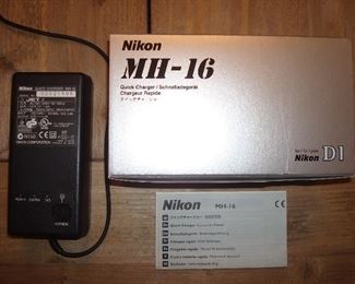Living Room: The NIKON MH-16 Quick-Charger has its original box and manual.