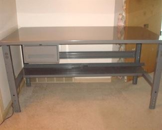 Living Room:  This TENNSCO Industrial Work Bench is like-new!  Its 12-guage steel top was covered with its original cardboard packaging top [which is included] so it's in perfect condition!  The work bench has one drawer and one under-shelf.  It measures 72" wide x 36" deep with adjustable height.  We displayed the trains on it as shown in the next photo.   