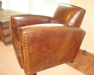 Family Room: This is a side view of one of the RESTORATION HARDWARE leather library chairs. It is an "Italian Berkshire" color leather.