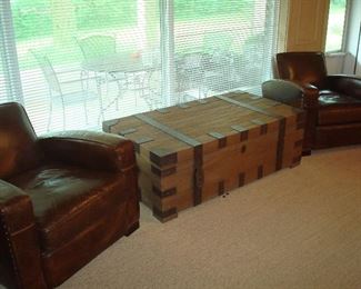 Family Room: Two RESTORATION HARDWARE leather library chairs flank a RESTORATION HARDWARE chest.