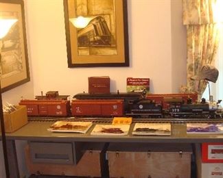 Living Room: The ACCUCRAFT trains and some track and books are now displayed on the work table Closer photos of each train are coming up.