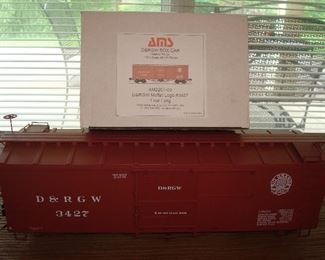 Living Room: The ACCUCRAFT D&RGW Box Car #3427 (AM2201-03) is 20-l/2" long and includes its original box as shown. It is 1:20.3 scale, 45m gauge.
