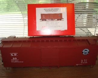 Living Room: The ACCUCRAFT Southern & Pacific #33 is 20-l/2" long and has its original box as shown. It is part of the Box Car Series 3000 (AM2201-16). It is 1:20.3 scale, 45m gauge.