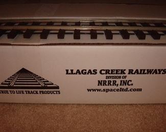 Living Room: There are FOUR boxes of brand new track--each priced per box. Each piece of track measures 6' long and there are 10 pieces in each box, for a total of 60' of track per box.