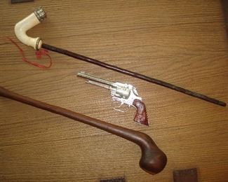 Living Room: An antique ADLER "meerschaum" long pipe is near a vintage CISCO KID cap gun (made in England), and an aboriginal club.