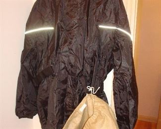 Living Room: This size LARGE rainwear suit by Milwaukee Motorcycle Clothing Co. is brand new! It includes the jacket and pants and two storage bags.