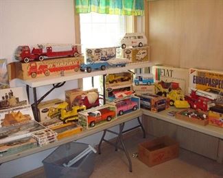 Bedroom #2: More vintage toys:  A-10 WARTHOG; German Panzserk Ampfwagen VI Tiger I; AH-64 Apache Attack Chopper; VOSPER Fast Patrol Boat Perkasa Sturm-PanzerIV Brummbar; TONKA Aerial Ladder Fire engine with original box;  TONKA Bulldozer with original box; TONKA Cement Mixer No. 2620 with original box; TONKA Mighty Rescue Vehicle (first issue) with drivers and patient and original box; NYLINT Road Grader No. 7910 with original box;  TONKA Trencher No. 2534 with original box; BUDDY L Zip's Mail Truck with original box; NYLINT [orange] Chevy Pick-up with original box;  NYLINT Kennels [pink] pick-up with topper & live stock and original box;  ESTES Model  Rocketry Field Operations;   FORD 7500 Back Hoe (no box); GILBERT 3-speed Motor Erector set with storage chest; TONKA Snorkel Fire Truck (no box); FIAT l/8 scale Pocher; LOTUS l/12 scale (Nichimo) Sports Car Europaspecial; Mattel 1960 Hot Wheels (48 car) Race Case;  TAMIYA Renault-RE20 Turbo-Big Scale Series (24); Classic HUBLEY Dusenber