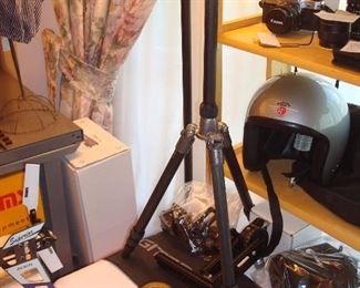 Living Room: A "REALLY RIGHT STUFF Gitzo Tripod/Omni Pivot Package" & more are priced as a unit. It is near an antique brass fire hose nozzle (Powhatan Fire House) AND an "indelible check perforator a/k/a Wesley Check Perforator" (vintage 1890-1897).