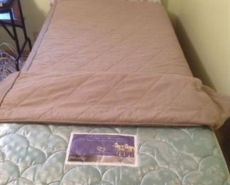 Bedroom #1: A SERTA Perfect Sleeper twin mattress set is priced separately from the vintage vinyl twin headboard/bed frame and bed cover.