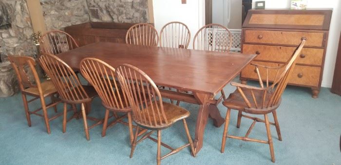 antique harvest table with bread board ends and bow back windsors