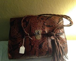 This Patricia Nash Design leather bag has a matching billfold.