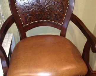 One of four fine-looking swivel bar stools