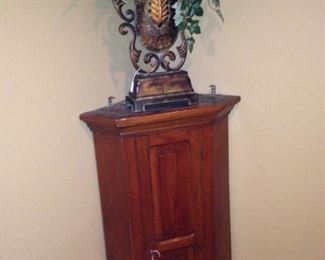Antique  cabinet and this tall arrangement will enhance any corner.