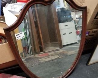 Antique armor shaped framed mirror  