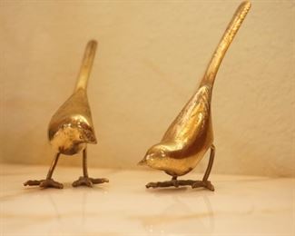 Playful brass birds