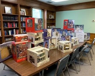  40 + Christmas village pieces,churches, stores, tree, people w number of horse and carriages in original boxes. 