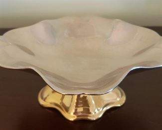 20 Silver and Golden Tone Cup and Saucer