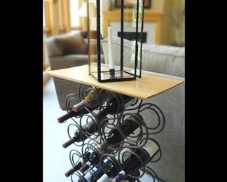 Wine Table, Rack and Large Candle in Glass.
