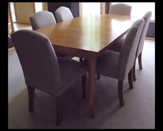 Formal Dining Room Table with Six Upholstered Chairs. The table measures 40" x 72" and includes two 18" leafs.