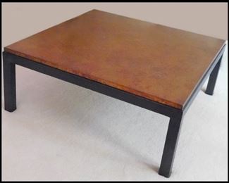 Heavy Copper Colored Coffee Table. It's very heavy. Please bring a friend or maybe your cousin to help load this. Measures 40" x 40" x 16". 