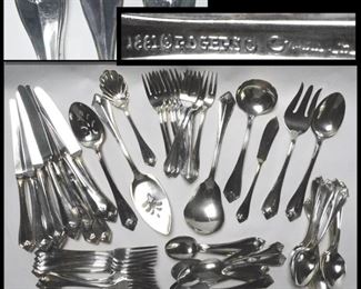 Rogers Pieces of Rogers Oneida Silverplated Flatware in the King James Pattern. Includes butter knife, 11 soup spoons, 11 tea spoons, 6 large serving pieces, 12 salad forks, 1 shell sugar spoon, 11 dinner forks and 12 knives. 