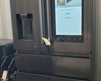 275: 22 cu. Ft. Counter depth 4 door french door Samsung fridge with family hub
This fridge has dark stainless steel. A family hub that is touchscreen. This fridge appears to be fully functional. Gets Cold. A new water filter in the box is included with the fridge.
 	 
