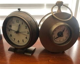 clock on the left, clock/effective self-defense weapon on the right.