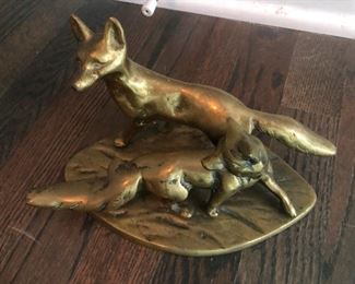 Brass foxes frolicking in a world where there's no such thing as a fox hunt