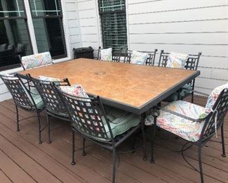 large outdoor patio table and chairs with cushions