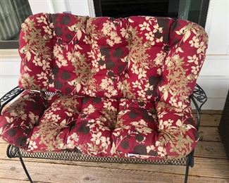 wrought iron settee with cushions ready to go dancing!