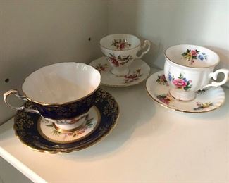 fancy tea cups and saucers. They don't match but that's the charm!