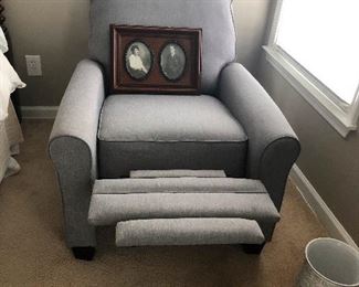 Holy wow! The armchair reclines! Also, framed pictures of the deceased waving you into the light.